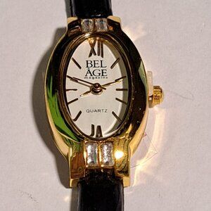 Bel age magazine women's gold tone watch with black strap